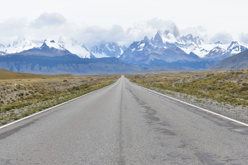 Street to Glacier National Park in El Chalten, Argentina, Patagonia with snow covered Fitz Roy Mountain in background