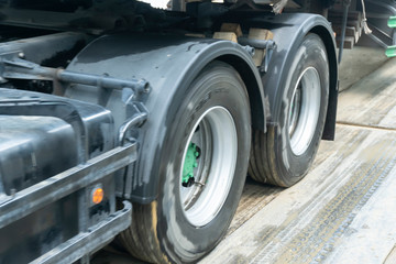 Fototapeta na wymiar Fast-moving images of truck wheels in transportation.