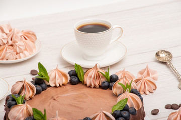 Chocolate poultry milk garnished with marshmallows and blueberries