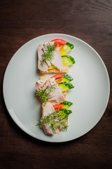 sandwich with chicken, cucumber and tomatoes