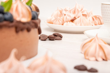 Chocolate poultry milk garnished with marshmallows and blueberries