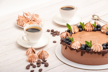 Chocolate poultry milk garnished with marshmallows and blueberries