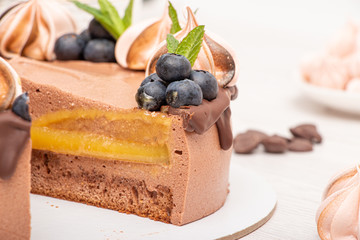 Chocolate poultry milk garnished with marshmallows and blueberries