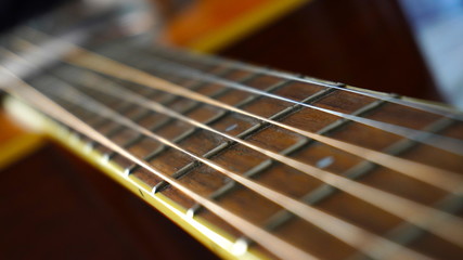 Close up macro on guitar strings. Musical instrument concept idea. Music and sound