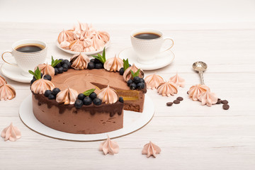 Chocolate poultry milk garnished with marshmallows and blueberries