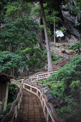 staircase climbing in a cave, Wat Tham Khao Chakan, Sa Kaeo, Thailand.