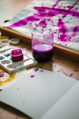 Composition from art materials. Watercolor. Watercolor paints. Stretching paint colors.