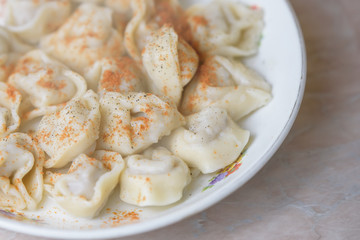 Meat dumplings pelmeni, ravioli with meat on plate