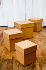 Cardboard boxes of different sizes with lids. Background for gift wrapping. Products from natural materials.