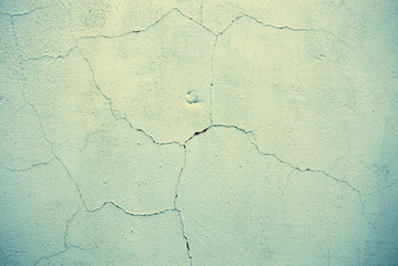 A piece of vintage wall with cracks and scuffs