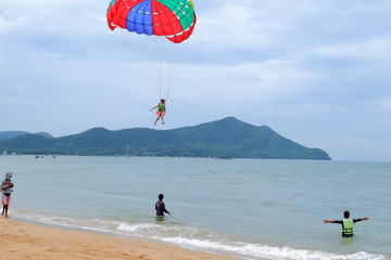 People playing  Parasailing in the sea