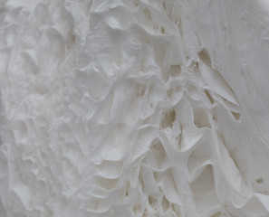 A splash of white paint. Abstract design abstract background. Macro texture and structure of white paint.