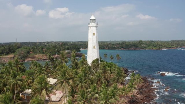 flying around the lighthouse in dondra sri lanka on a bright sunny day