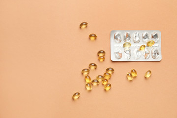 Blister pack with pills on color background