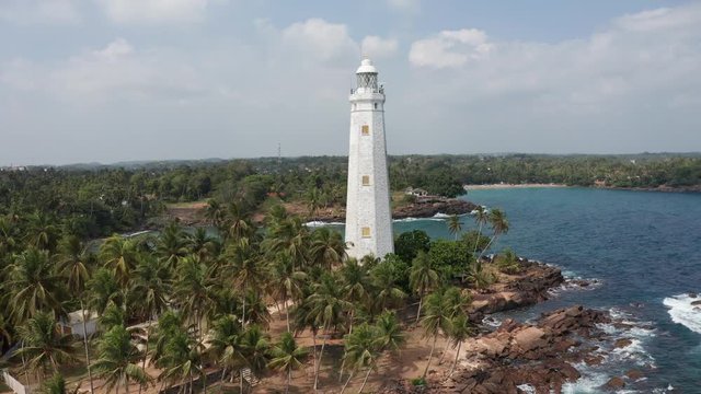 flying around the lighthouse in dondra sri lanka on a bright sunny day