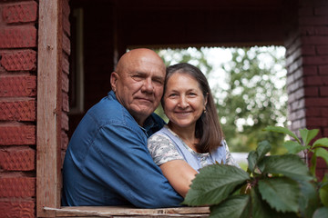 Fototapeta premium elderly couple on balcony on summer day.