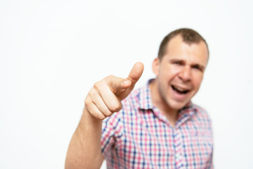 Young man showing his index finger towards the camera