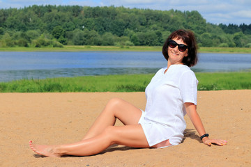 woman on the beach in a white dress