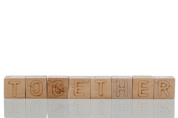 Naklejka premium Wooden cubes with letters together on a white background
