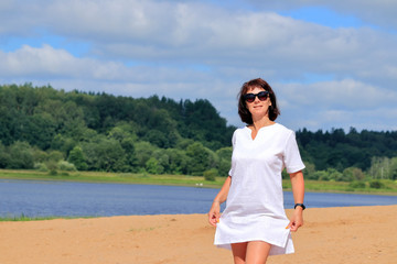 woman on the beach in a white dress