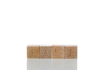 Wooden cubes with letters ease on a white background