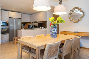 Interior design in villa, house, home, condo and apartment feature wooden dining table, dining chair and kitchenette