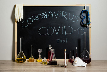 Test tube with blood for testing. Coronavirus blood test concept. In vitro test for the presence of COVID-19 in the laboratory. - 334973970