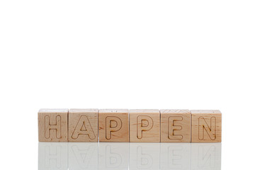 Wooden cubes with letters happen on a white background