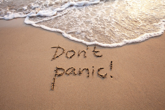 Don’t panic concept written on the sand, stress.
