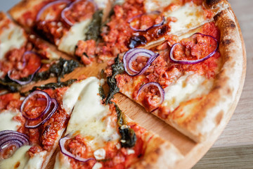Pizza Salsiccia with spicy sausage ,red onion , fior di latte and tomato sauce