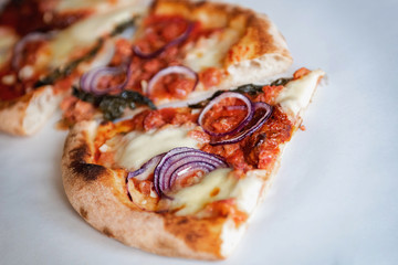 Pizza Salsiccia with spicy sausage ,red onion , fior di latte and tomato sauce