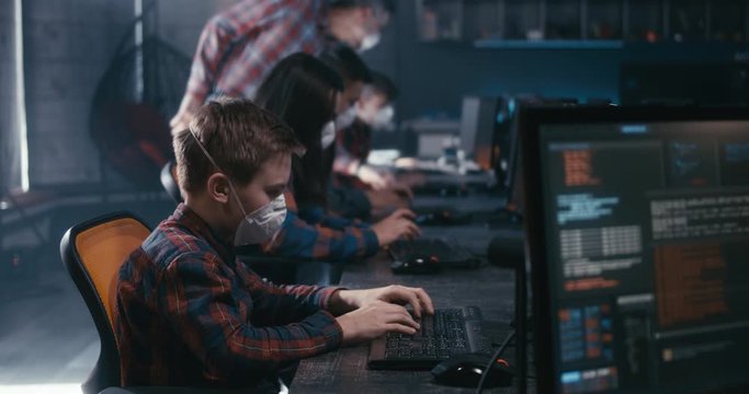 Student and teacher discussing programming in school