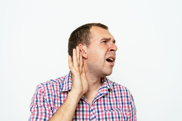 Overhears a man, tries to listen.