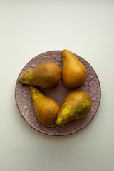 fresh pear on a plate. Top view.