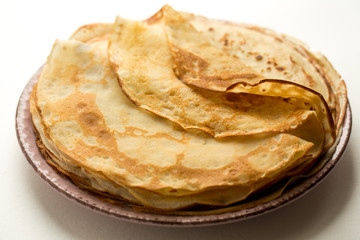 pancakes on a plate. homemade thin fried pancakes. 