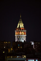 Fototapeta na wymiar Galata Kulesi Tower at night in Istanbul, Turkey. Ancient Turkish famous landmark in Beyoglu district, European side of the city. Architecture of the Constantinople.A historical place made by Genoese