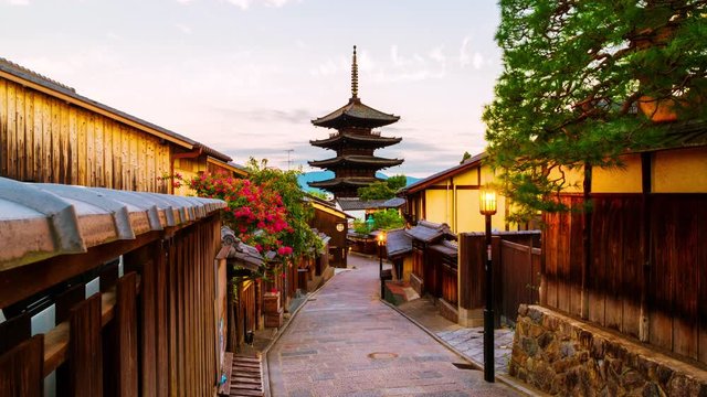 Kyoto, Japan. A sunrise timelapse with a view of To-ji temple and a row of old japanese shops and houses in Kyoto, Japan. Time-lapse