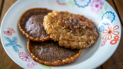 Close up view of Cucur Jawa or Cucur Topi, a traditional Malay food in a white plate.