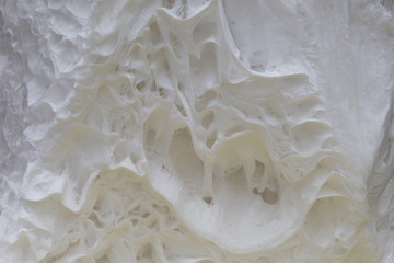 A splash of white paint. Abstract design abstract background. Macro texture and structure of white paint.