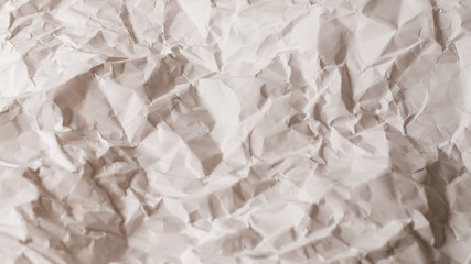 Crumpled white paper background.