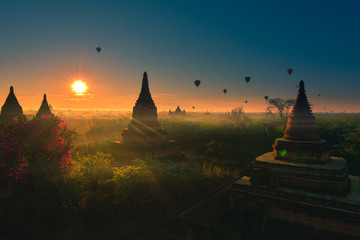 Bagan Myanmar Hot air balloons flying over stupas at Sunrise