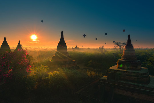 Bagan Myanmar Hot air balloons flying over stupas at Sunrise