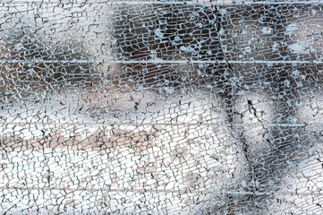 cracked glass texture. broken car window. cracked glass close up. vandalism of adolescents