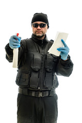 Concept Isolated portrait on a white background man in black police special forces with cleaning products in hands