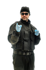 Fototapeta premium Concept Isolated portrait on a white background man in black police special forces uniform in medical gloves