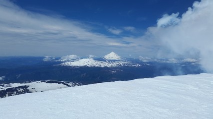 landscape with mountains, volcano and blue sky