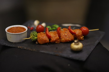 whole chicken merinated drumstick and boneless with sauce and spices on table