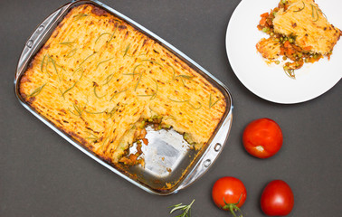 Shepherd, cottage pie dish on black background