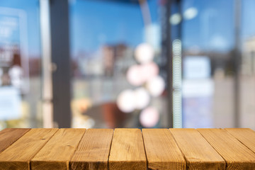 Empty tropical wood table and blurred garden cafe light background. product display template.Business presentation