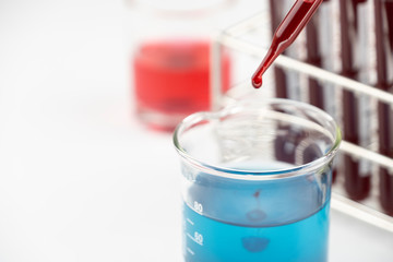 Methylene blue test liquid with blood sample for test, laboratory sample of blood testing for diagnosis virus infection, the pandemic infectious concept